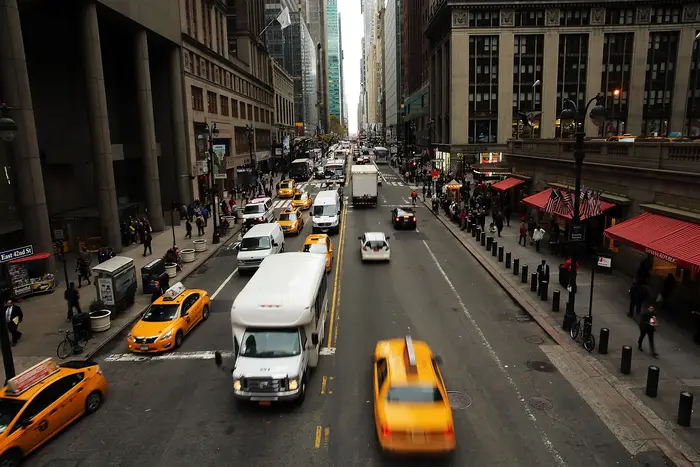Cars driving on a street in Manhattan.